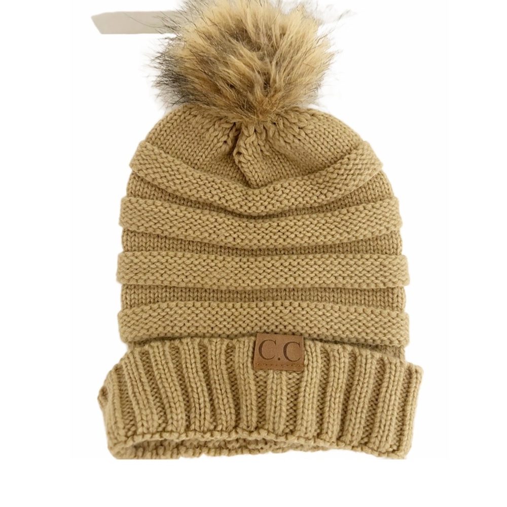 C.C pompom beanie. Tan/beige in color. One size fits all.